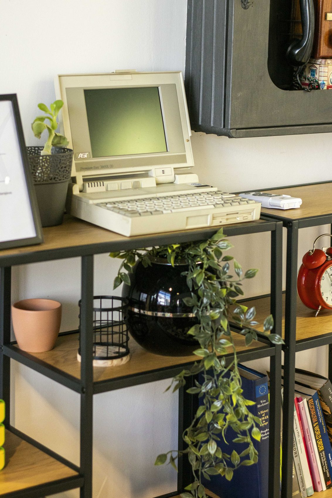 Vintage computer on a metal shelf