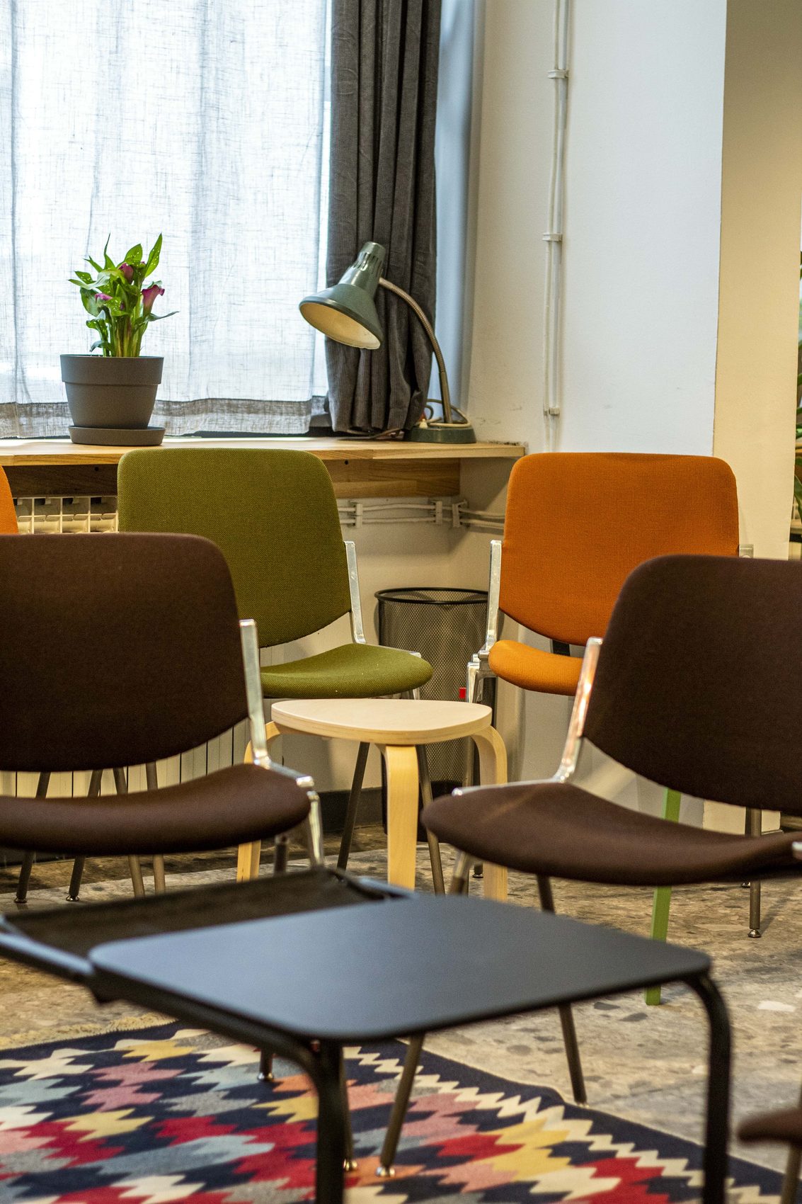 Desk lamp and chairs in the meeting space